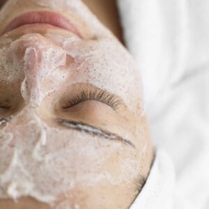 lady getting a professional exfoliation with her facial at dream med spa